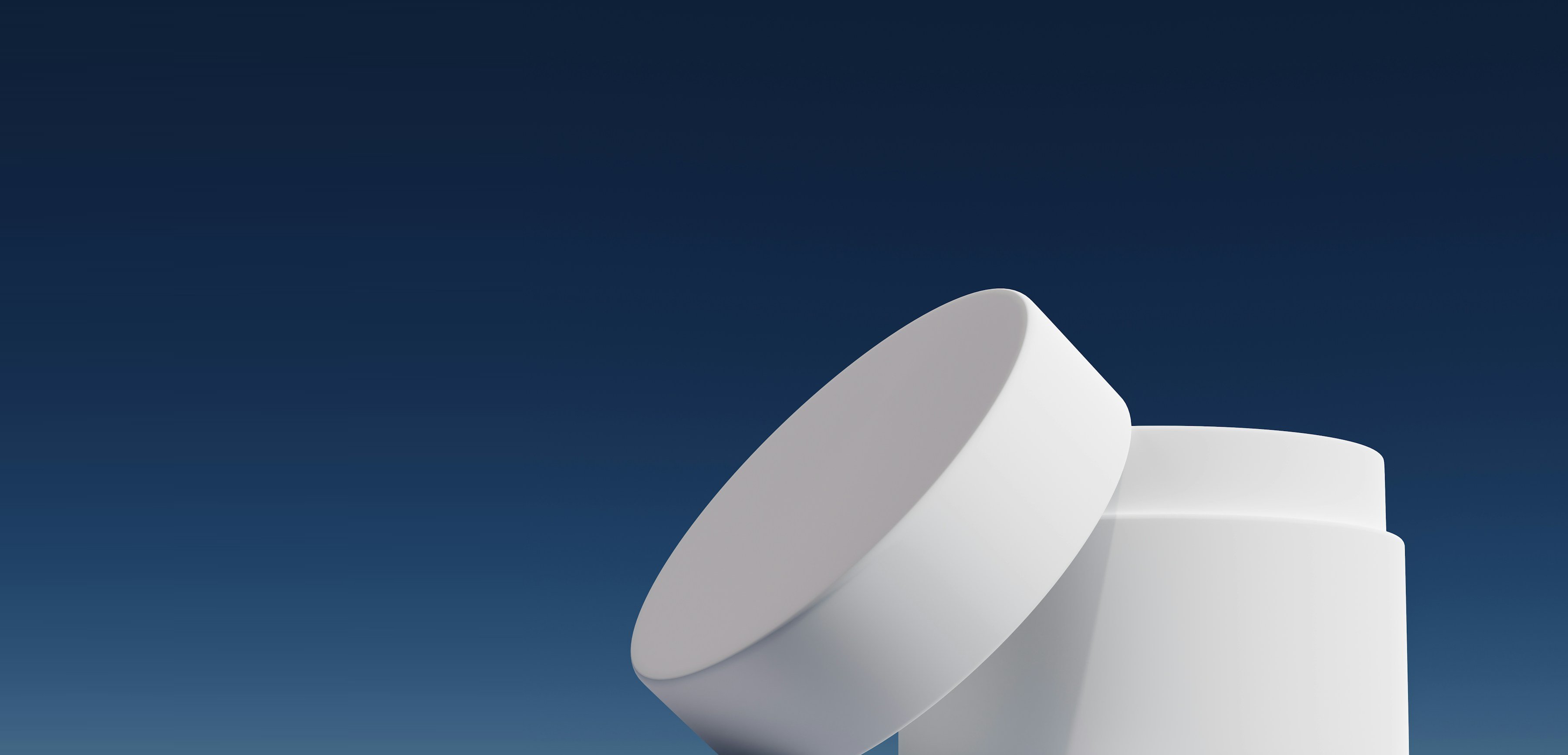 Open white cream jar photographed against a deep blue background