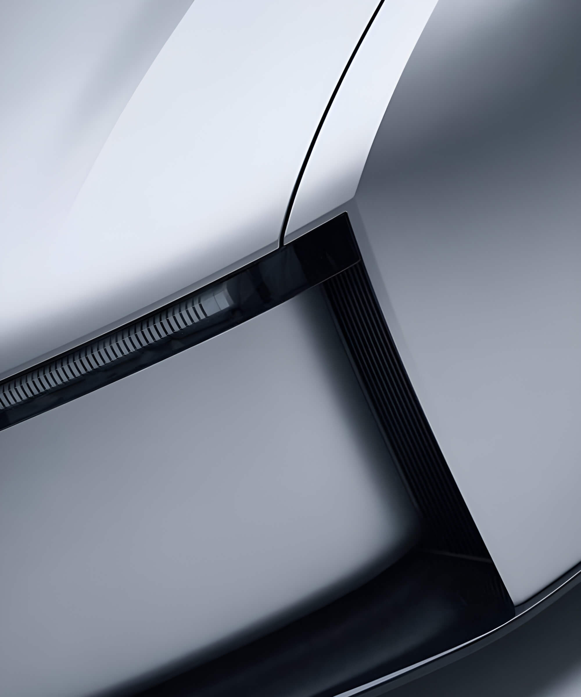 Détail d'une carrosserie métallique argentée aux lignes courbes, visuel de survol du projet Ariel Ascot